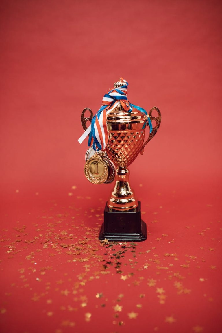 medals tied on a trophy