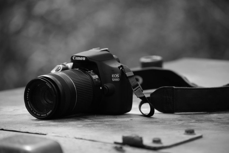 canon dslr camera on table